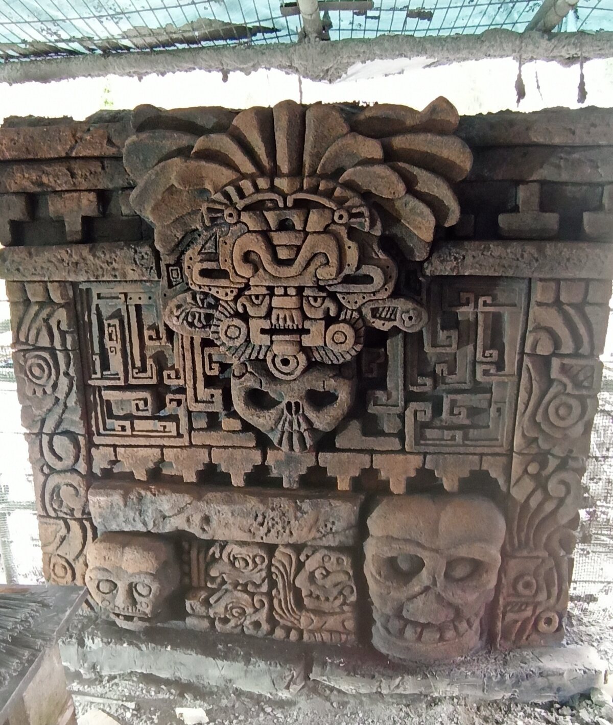 Carved stone stela with figurative and geometric relief at Seville Aquarium